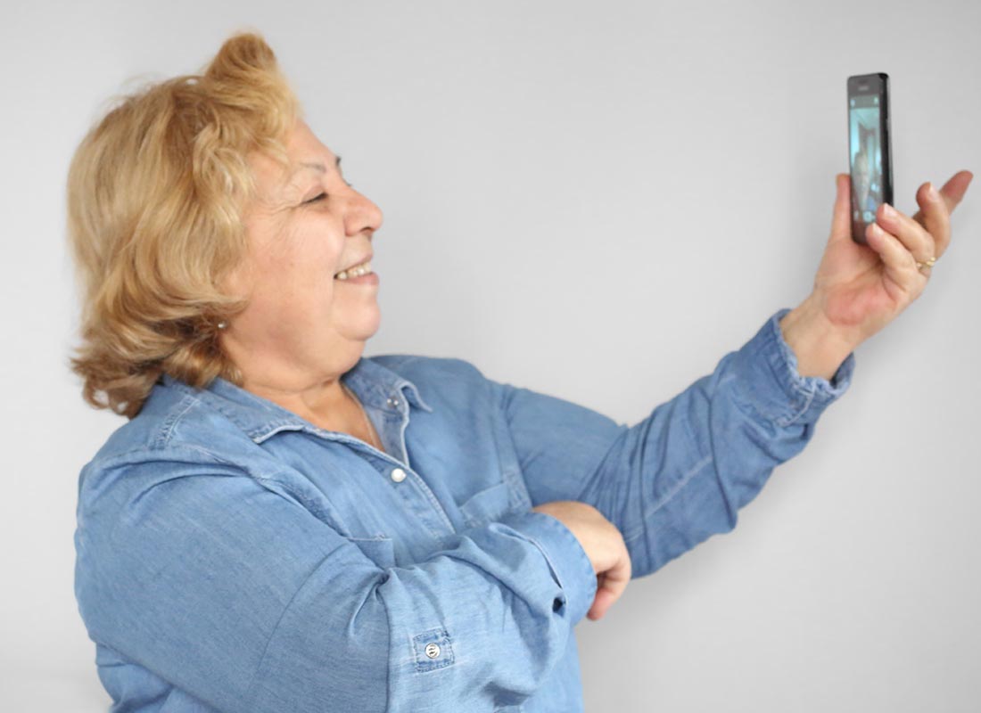 A lady chatting on a video call using her mobile phone