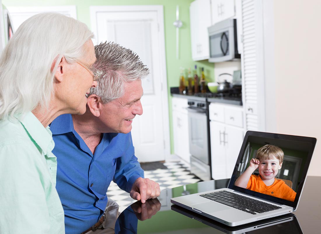 Grandparents chatting to their grandson over a video call