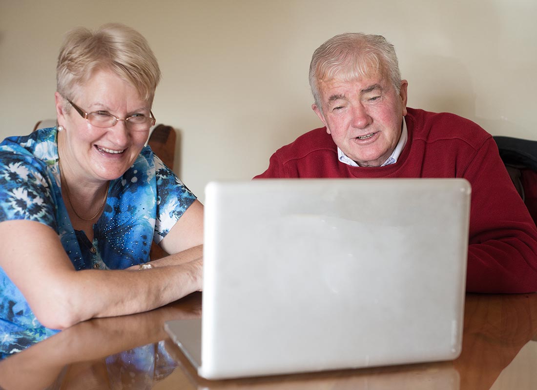 A couple enjoying video chatting to their family