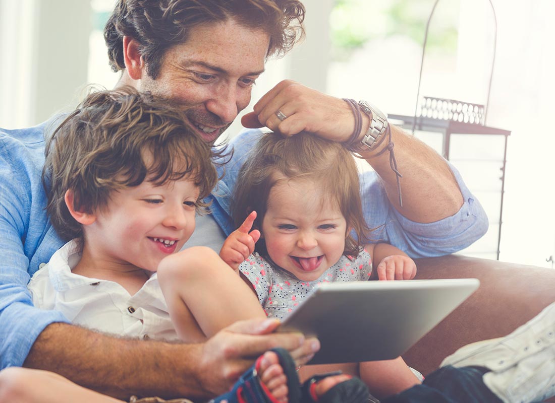 A dad and his kids enjoying a video call together