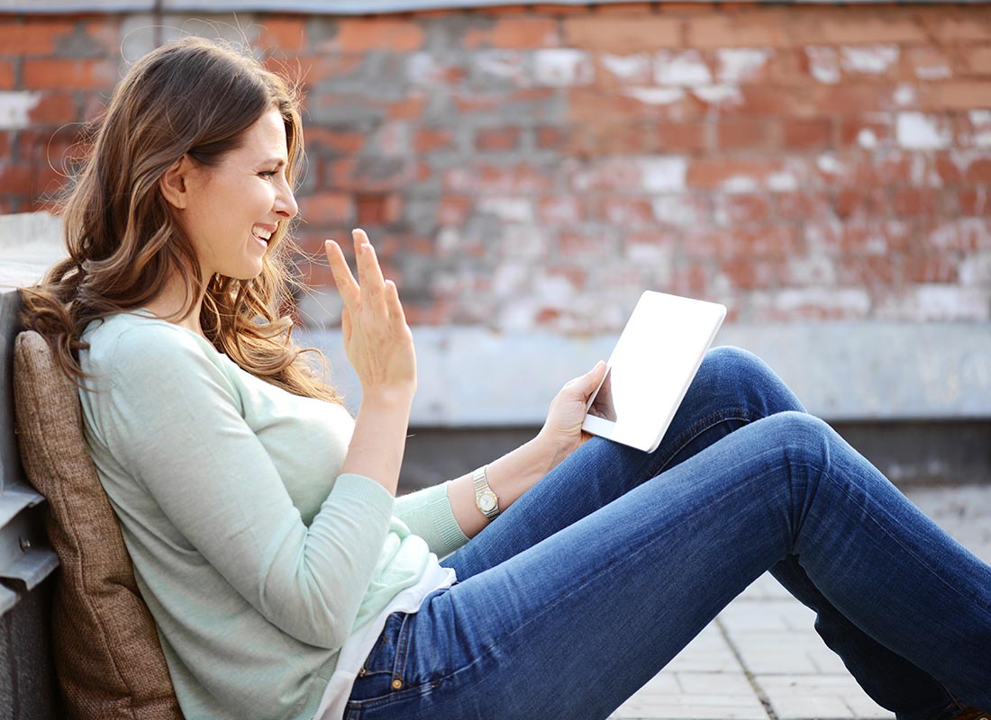 A young lady enjoying video chatting with friends