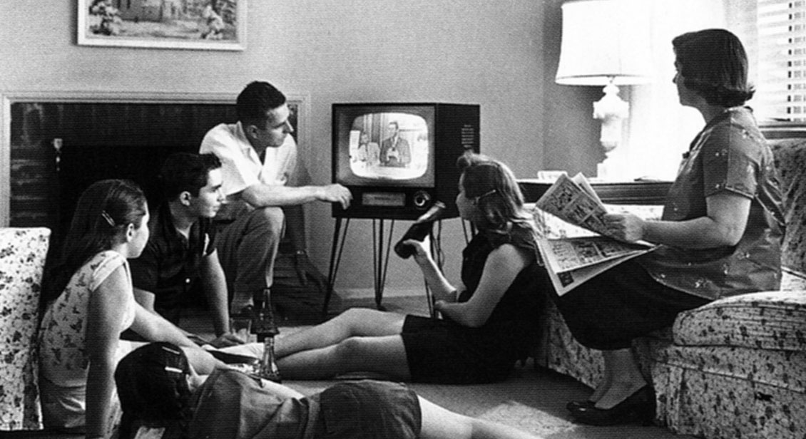 Family watching television circa 1958.