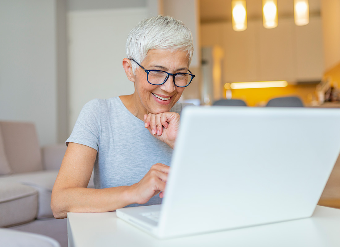 A lady is checking her bank account balance from home