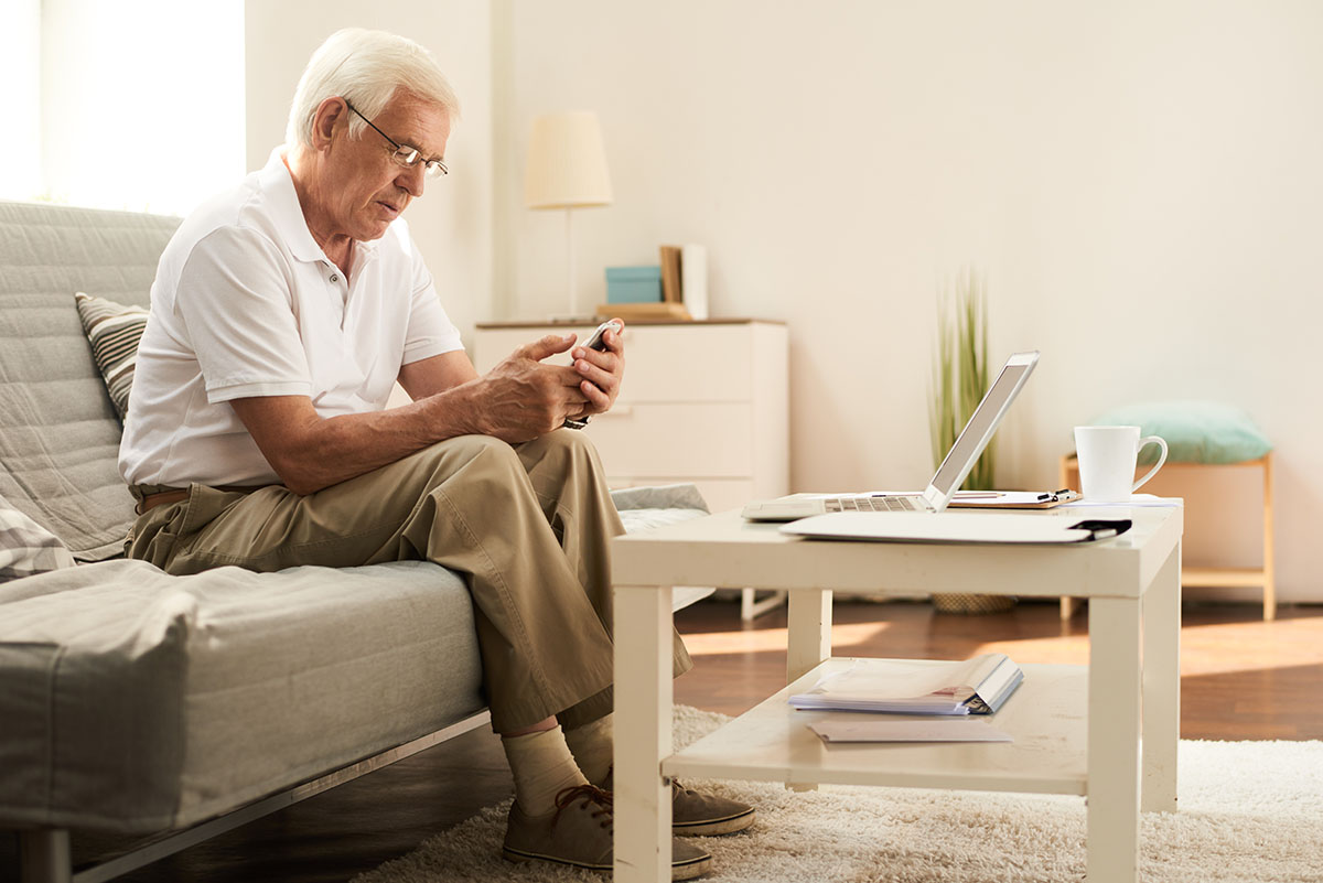 A gentleman checking his PayPal account settings.