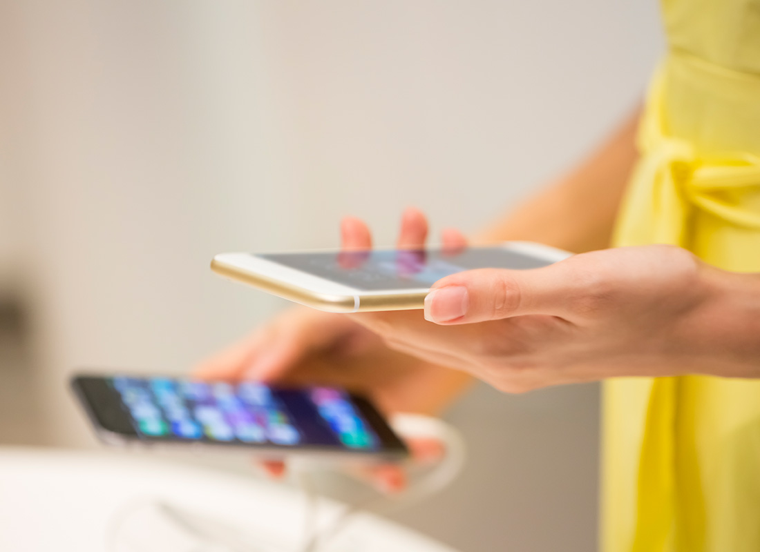 A lady reading her email on a mobile phone