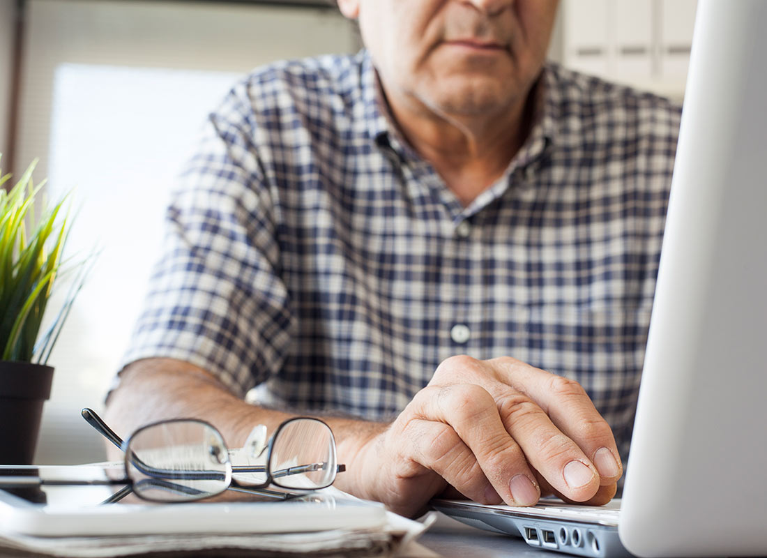 A person working on their laptop computer