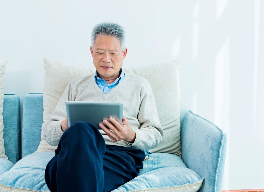 Relaxing on the couch and reading the news on a tablet device