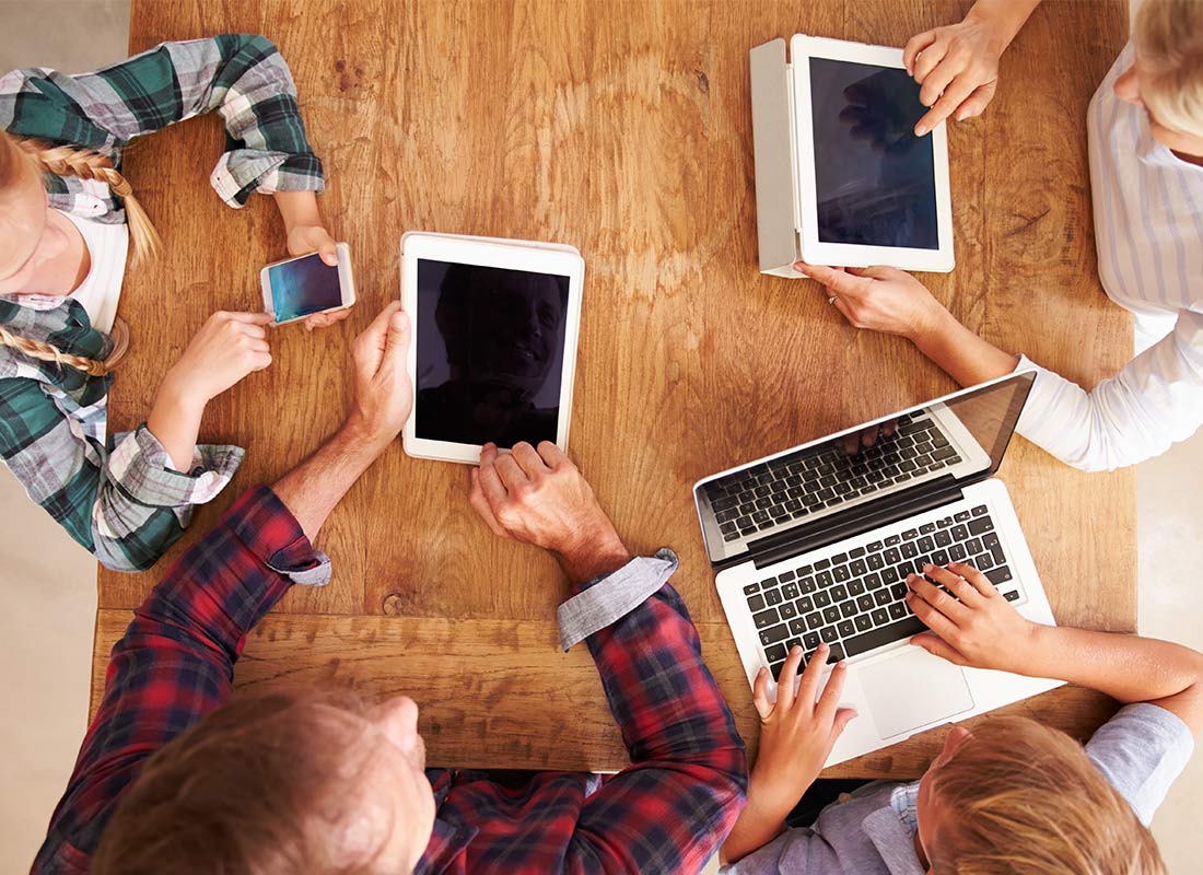 A family all using their devices on their home Wi-Fi network