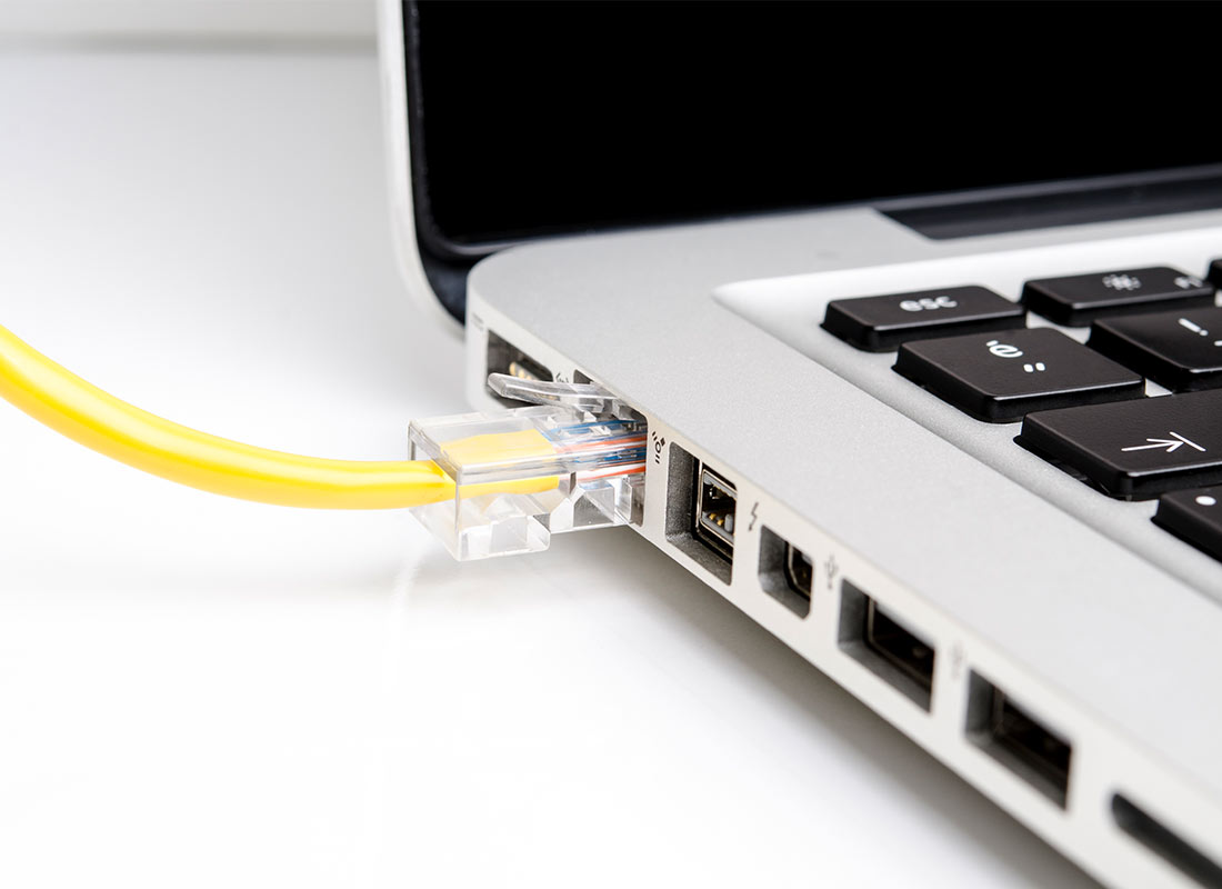 A laptop computer connected to a cable