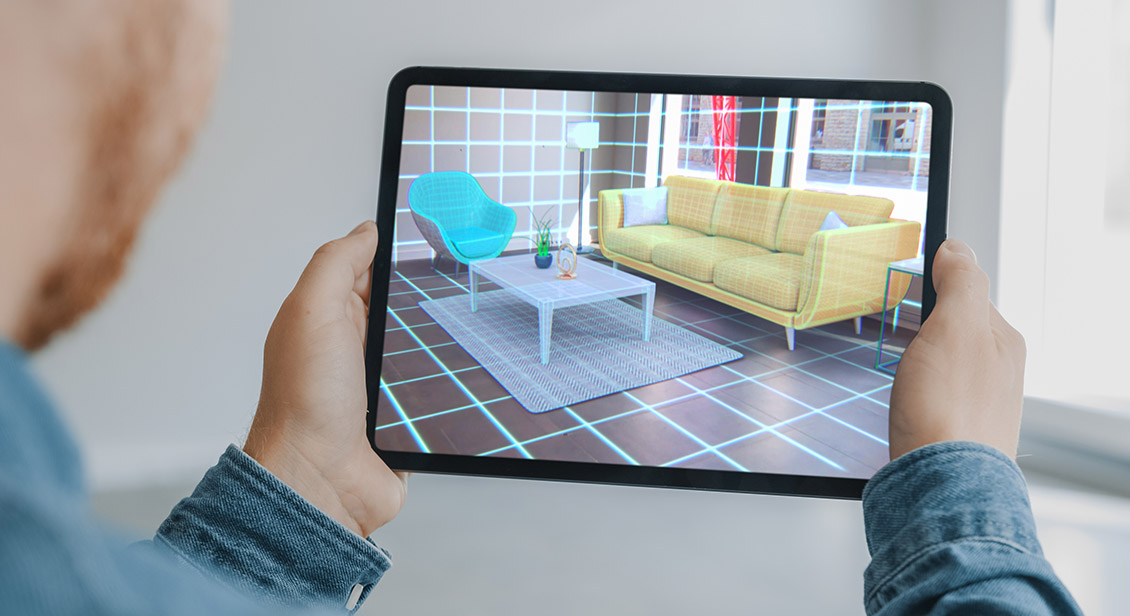 Man Holding Digital Tablet with AR Interior Design Software Chooses 3D Furniture for Home.