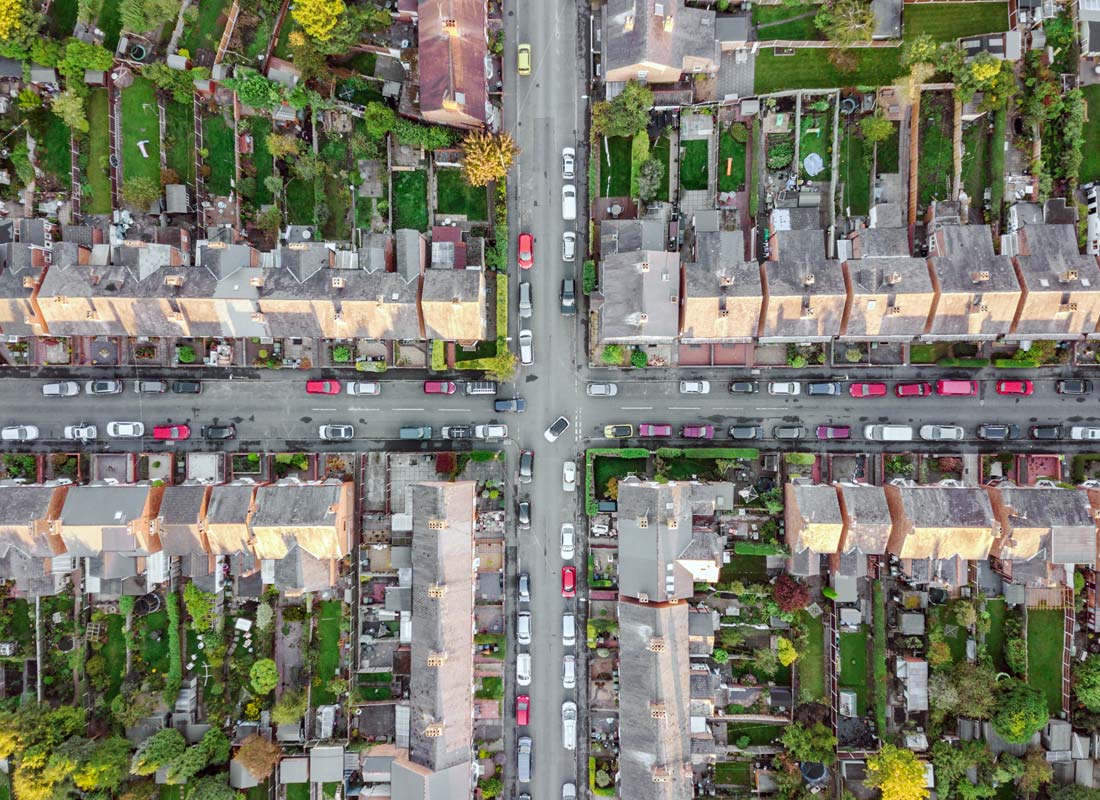 An aerial photo of a suburban street cross section. The photo may have been taken from a drone as it’s looking directly down to the ground.