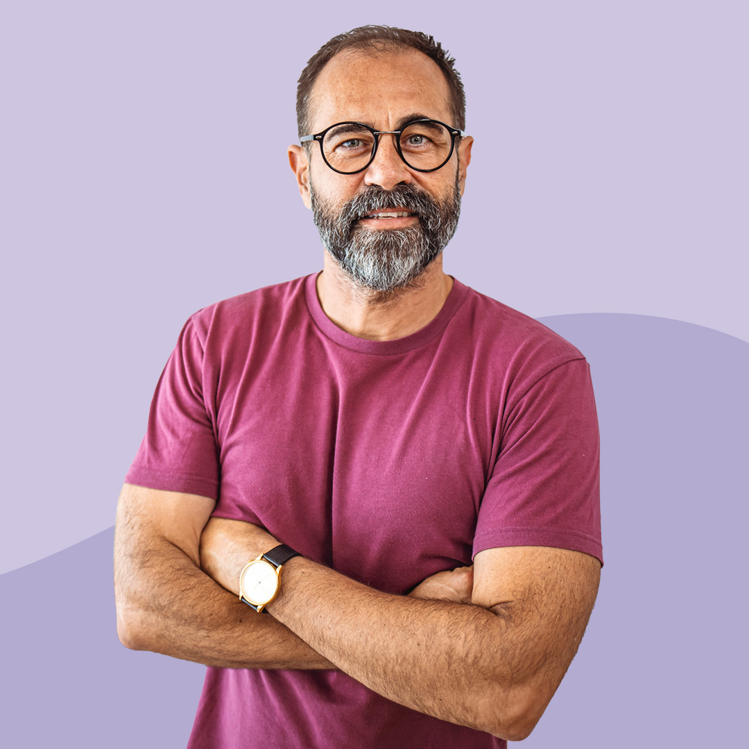 A man with crossed arms looking confident
